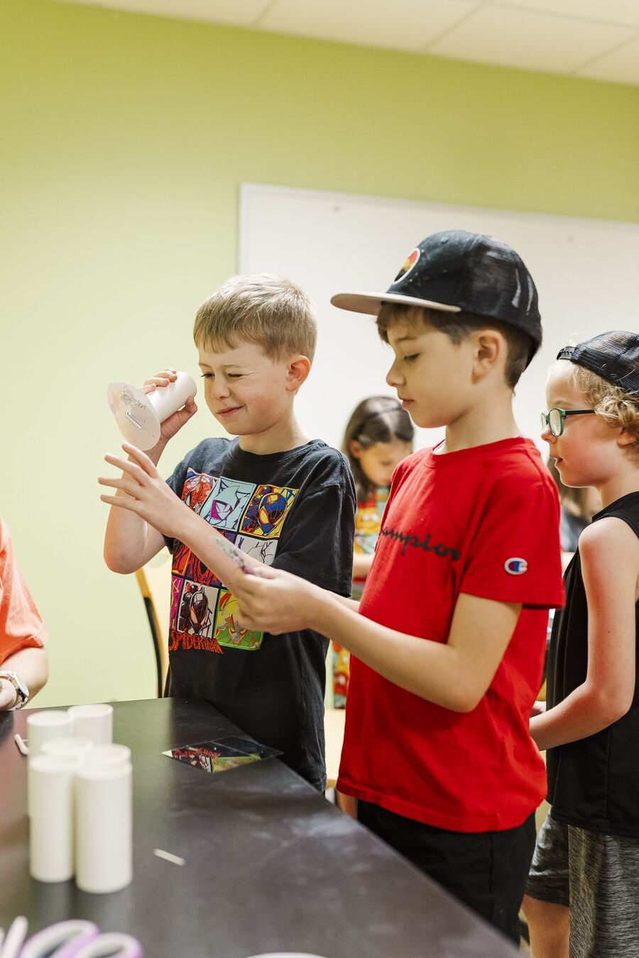 Boys doing science experiments at STEAMCamp