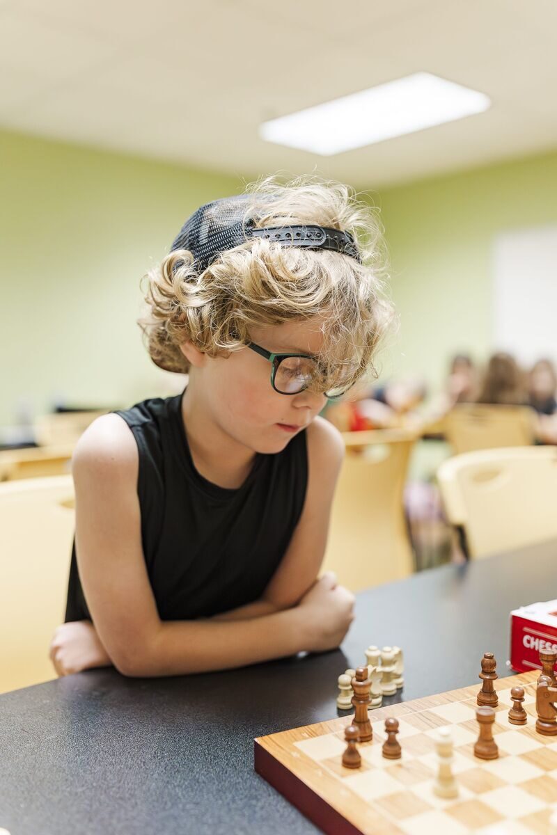 Student focused on chess