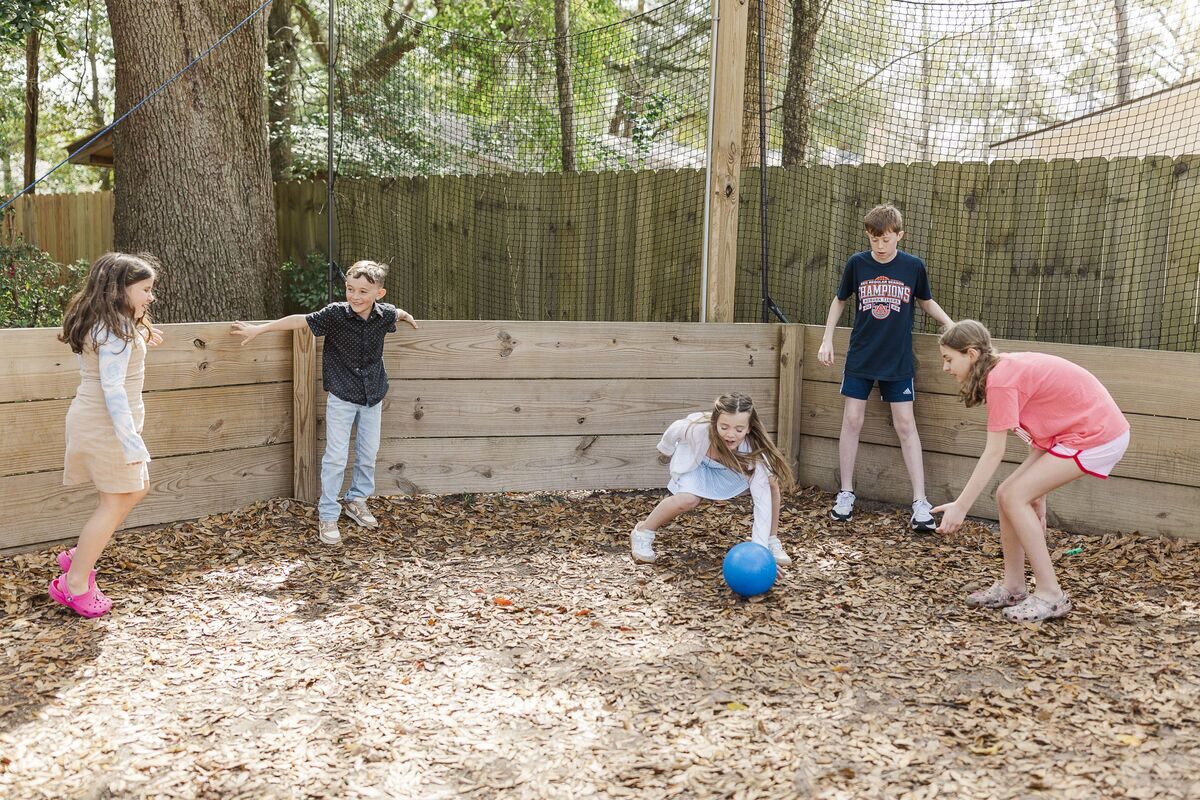 Kids playing outdoors at STEAMCamp
